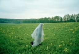 A woman prayed in the early morning on a pilgrimage in Kirov region, Russia, 1997